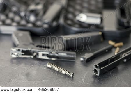Close Up Shallow Dof Indoor Shot Of Disassembled Gun For Cleaning
