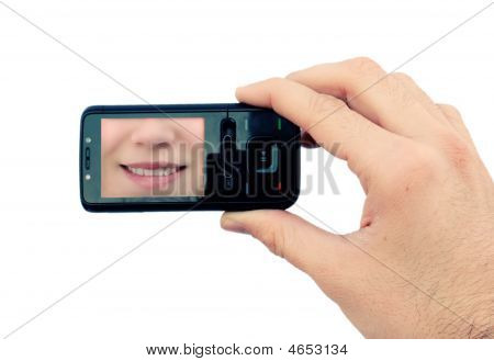 휴대 전화 및 미소와 손