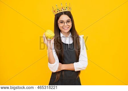 Princess Child In Queen Crown Hold Apple Isolated On Yellow Background. Teenage Girl Wear Diadem. Ha