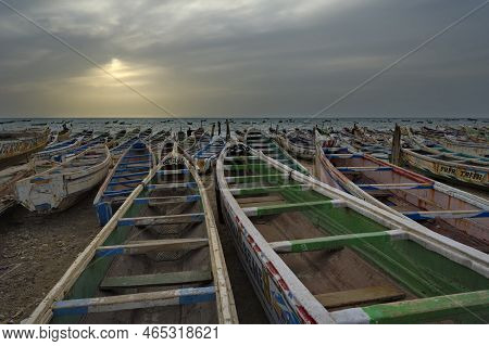 Nouakchott. Mauritania. October 04, 2021. Hundreds Of Huge Painted Wooden Boats, On Which Local Fish