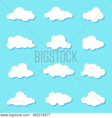 Different Clouds On Blue Sky In Origami Design. Collection Of White Paper Cut Out Cloud Icons. Paper