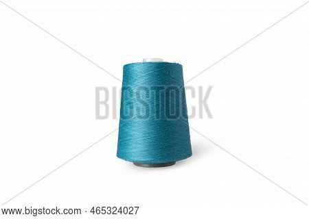 Spool Of Sewing Thread Isolated On White Background. Blue Green Thread Used By Factories In The Clot