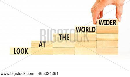 Look At The World Wider Symbol. Concept Words Look At The World Wider On Wooden Blocks On A Beautifu