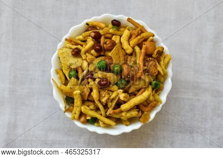 Top Views Of Mix Chanachur Over White Background Named Bombey Mix. Popular Tea-time Food In India. S