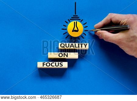 Focus On Quality Symbol. Concept Words Focus On Quality On Blocks On Beautiful Blue Table Blue Backg