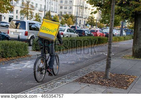 Warsaw Poland; October 2; 2022: Man On A Bike From The Company Glovo. Glovo Rider, Deliveryman On A 