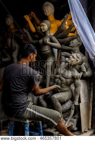 Kolkata, India - August 28, 2022: An Idol Maker Making A Clay Idol Inside Inside Idol Making Studio 