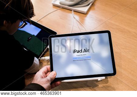 Paris, France - Oct 28, 2022: Male Hand Close-up Of New Apple Computers Ipad Air In Store - Looking 