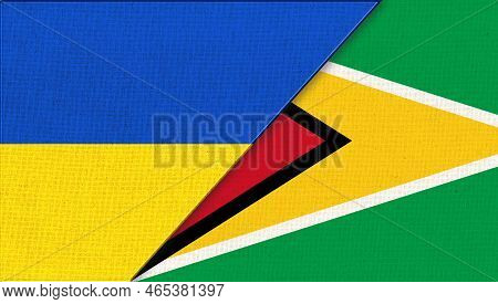 Flags Of Ukraine And Guyana. Ukrainian And Guyanian Flags On Fabric Surface. National Symbols.countr