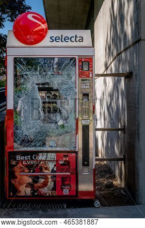 Lausanne, Vaud, Switzerland - 21 September, 2022: Damaged Selecta Vending Machine. Broken Glass. Vio