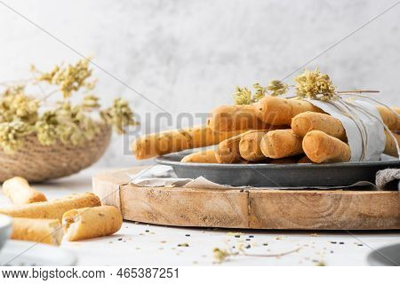Breadsticks Grissini. Bread Sticks With Sesame Seeds, Oregano And Olive Oil And Balsamic Vinegar On 