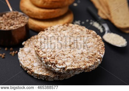 Rice Cakes And Rusks On Black Table, Closeup