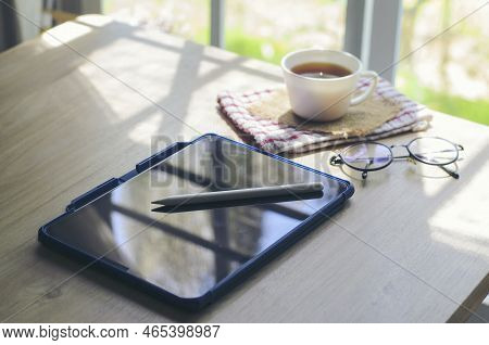 Desk For Student Concept. Tablet And Digital Pencil For Study For Exam Placed On School Table For St