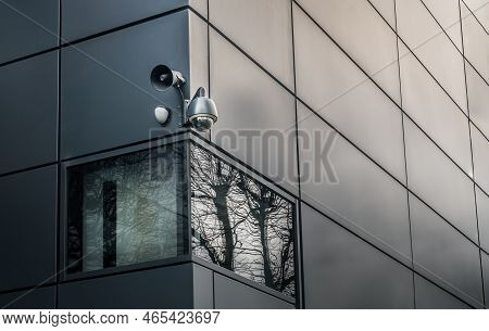 Security Camera Or Cctv Is Outsite On The Wall Of The Modern Building. Video Equipment For Safety Sy