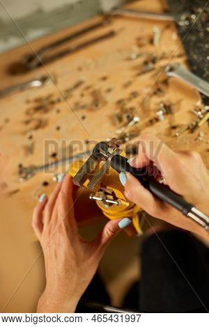 Woman Using Power Working Grinder Machine, Female Hand Grinds A Metal Nuts