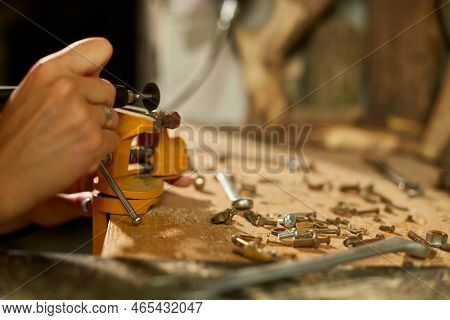 Woman Using Power Working Grinder Machine, Female Hand Grinds A Metal Nuts