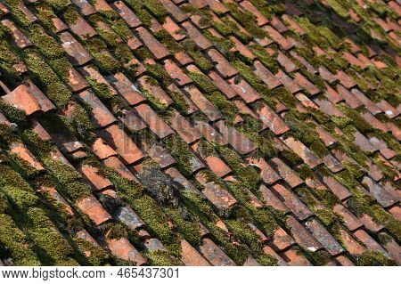 Roof Of Old Country House From Weathered Aged Clay Tiles Closeup, Old Cracked Tiled Roof