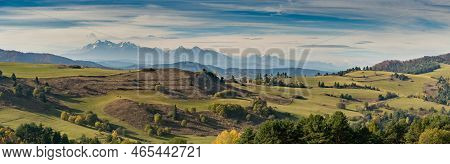 Mountain Scenery With Green Pastures And Rocky Tatra Mountains In The Background During The Day.