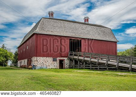Abernethy, Sk- Aug. 21, 2022: A Woman In Period Costume Feeding A Sheep Outside W. R. Motherwell\'s 