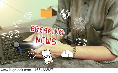Online Breaking News Concept. Hand Holding Smartphone Using To Watch Around The Globe News And Daily
