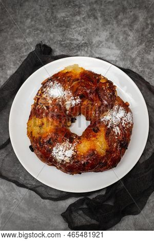 Typical Portuguese Fruit Cake Bolo Rainha On White Plate
