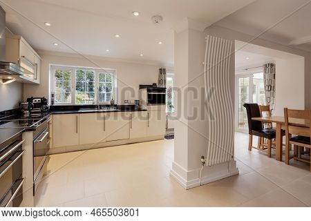 Newmarket, Suffolk, England - Feb 8 2019: Luxury Fitted Kitchen With Built In Appliances, Dining Tab