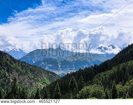 Top View Of Mountains And Blue Clouds At The Desan Meadows Mountain In Kalam Valley