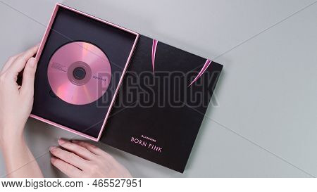 Hands Holding Blackpink Born Pink 2nd Album Box Set On Grey. Pink Music Cd. South Korean Girl Group 