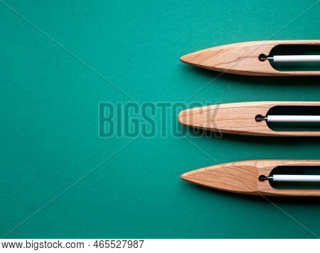 Three Wooden Boat Shuttles For Handloom, Copy Space. Concept Of Weaving Tools Or Equipment