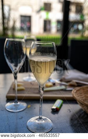 Tasting Of White Brut Sparkling Champagne Wine Outdoor In Cafe In Reims, Champagne, France