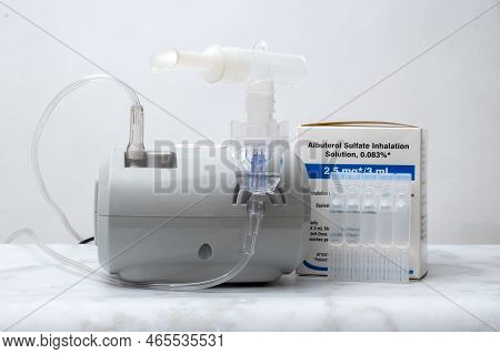 Davis, Ca, August 11 2022. Box Of Albuterol Sulfate Inhalation Product With At Home Inhaler
Against 