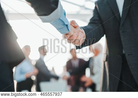 Close Up. Business Handshake On An Office Background