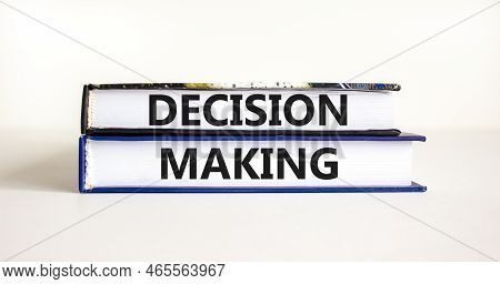 Decision Making Symbol. Concept Words Decision Making On Books. Beautiful White Table White Backgrou
