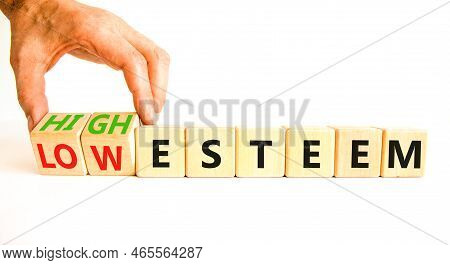High Or Low Esteem Symbol. Concept Words High Esteem And Low Esteem On Wooden Cubes. Businessman Han
