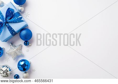 Christmas Day Concept. Top View Photo Of Blue White Silver Baubles Giftbox With Ribbon Bow Disco Bal