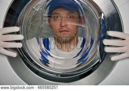 Confused Expression On His Face Is Close-up Of Master In Blue Robe Looking Through Glass Door Of Was