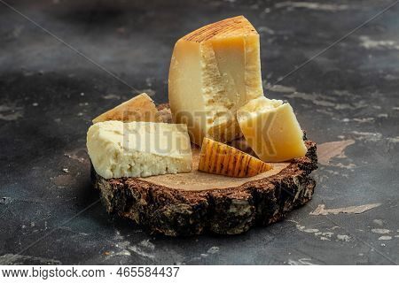 Traditional Gravyer Gruyere Cheese Hard Yellow Cheese Without Holes, With A Dark Crust And A Pleasan