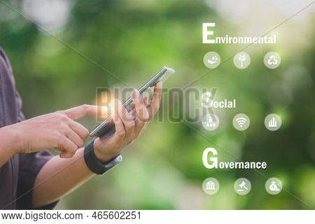 Hand Holding Phone Esg Icon Concept In The Hand For Environmental, Social, And Governance In Sustain