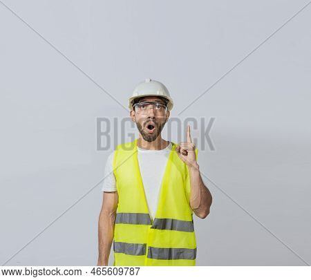 Amazed Engineer Man Pointing Up, Surprised Young Architect Pointing Up, Amazed Engineer Pointing At