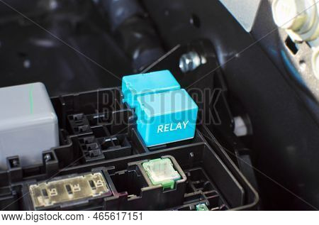 The Car Electronic Relay In Slot Of Relay Socket Box On Engine Compartment, Automotive Parts Concept