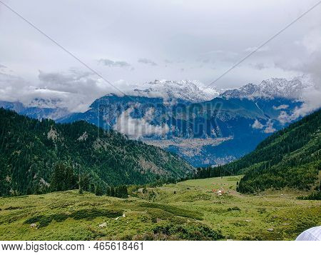 A Selective Focus On Mountains At Blur View Of Clouds At Top Of The Desan Meadows Mountain Kalam Val