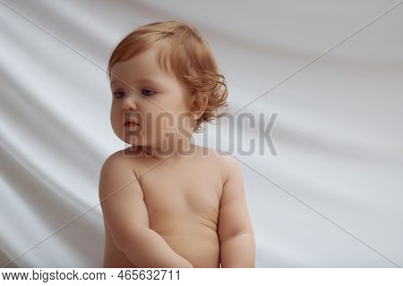 Just Beautiful. Cute Smiling Baby . Cute 10 Month Old Baby Girl With Her Big Blue Eyes. Closeup. 10 