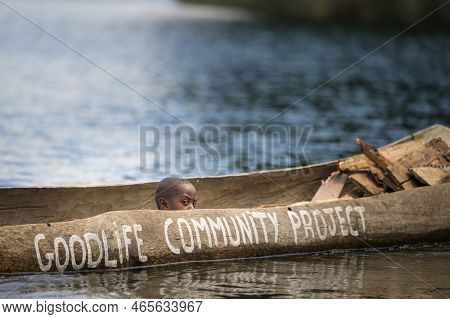 Kabale, Uganda - June 12, 2022: Children In A Dugout Canoe On Lake Bunyonyi (uganda), Sunny Day In S