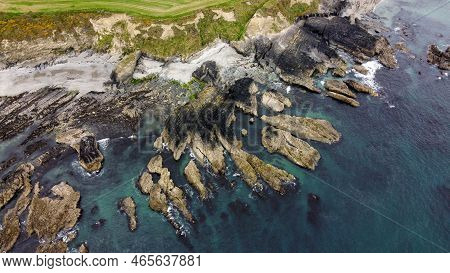Rocks On The Irish Shore, Top View. The Coast Of The Atlantic Ocean. Nature Of Northern Europe. Rock