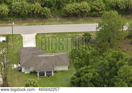 Aerial View Of Typical Contemporary American Private House With Roof Top Covered With Asphalt Shingl