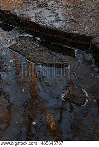 Reflections Of Late Autumn Are In The Waters Of Sawmill Creek Amongst The Rocks Of The Creek Bed, Wa