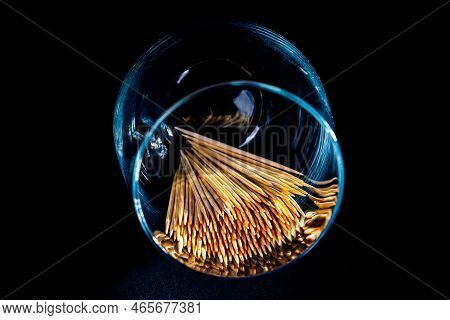 Bamboo Wooden Toothpicks In Glass Jar, Wine Glass. In Bucket. Toothpicks On Black Background. Front