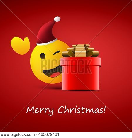 Merry Christmas! - Smiling And Winking Santa Claus Emoji With Waving Hand And Red Gift Box - Simple 
