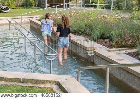 Grafenau, Bavaria, Germany, August 04, 2018: Two Young Girls Taking A Kneipp Cure In Summer At The S