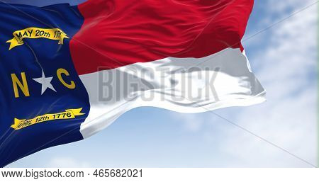 Close-up View Of The North Carolina State Flag Waving. North Carolina Is A State In The Southeastern